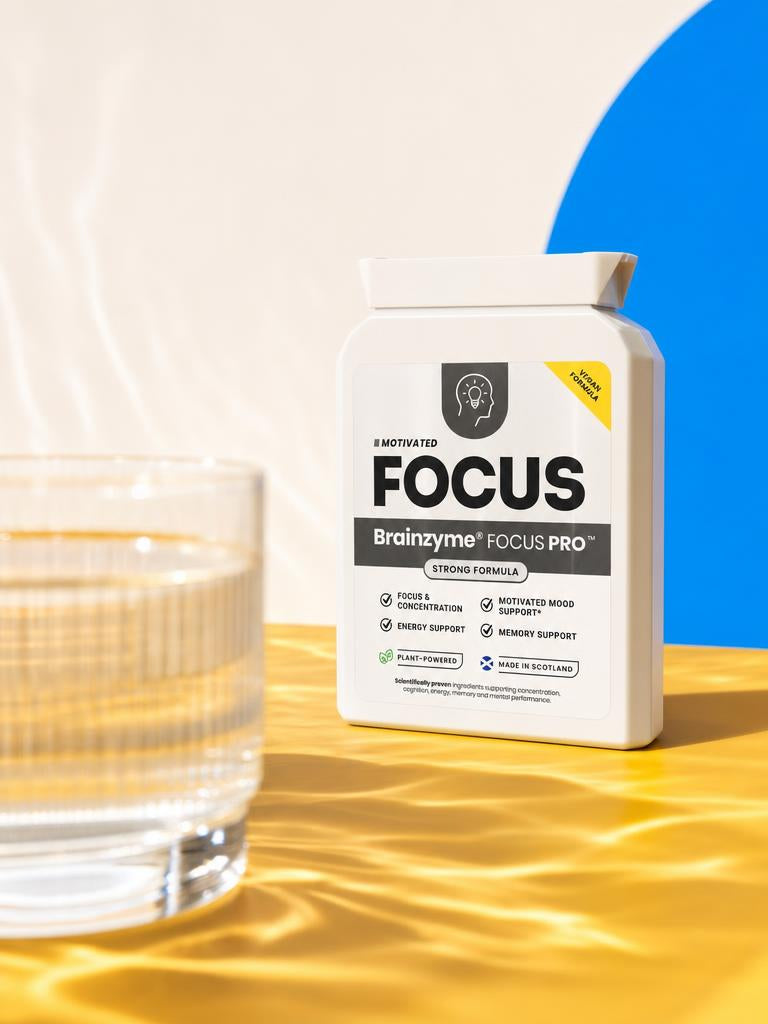 Brainzyme FOCUS PRO with a glass of water in rippling light